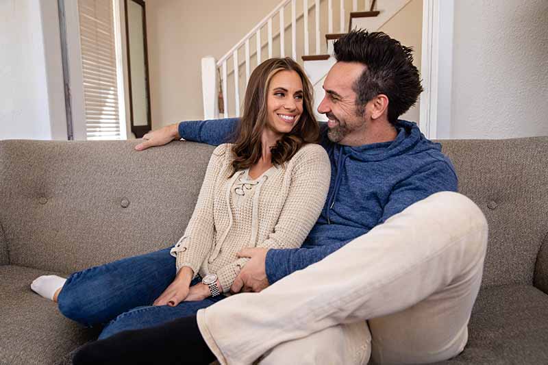 Couple Enjoying Good Airflow in Living Room