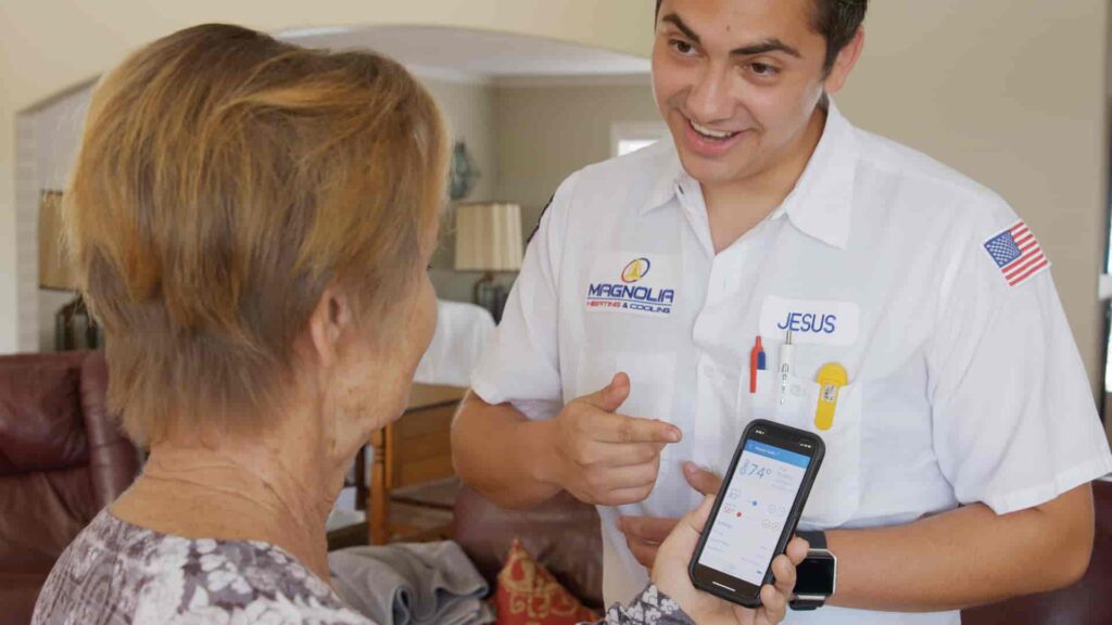 Riverside homeowner meeting with an AC company technician